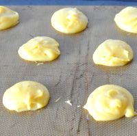 spoon mounds out onto a baking mat