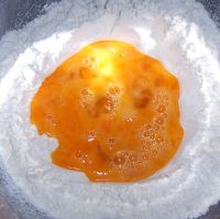 Make a well and add eggs to the flour