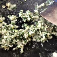 Cook the garlic, shallots and herbs.