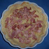 Scatter bacon into the pastry