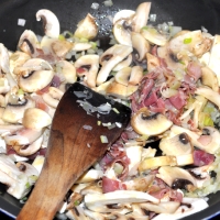 Add the mushrooms and prosciutto.