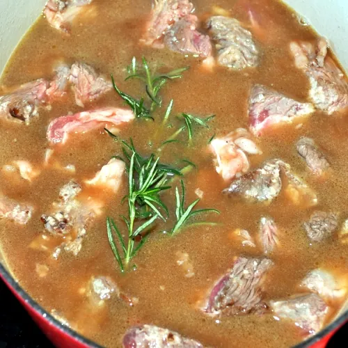 Add the stock and rosemary