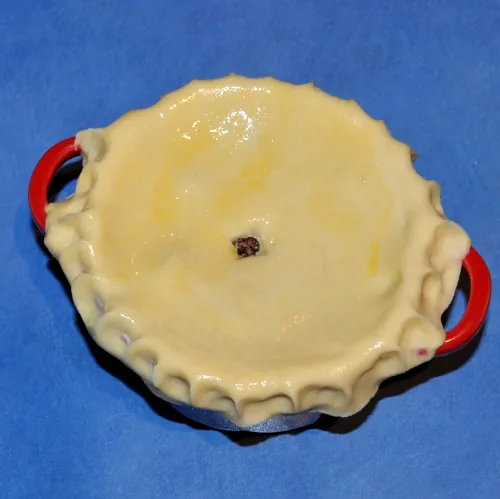 Brush with egg and make air hole